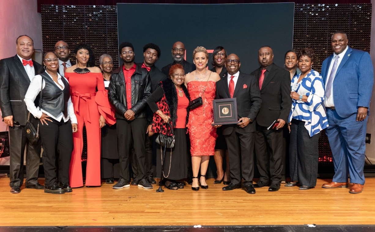 Darrell Miller with guests on stage